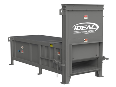 Gray industrial trash compactor with a side loading design